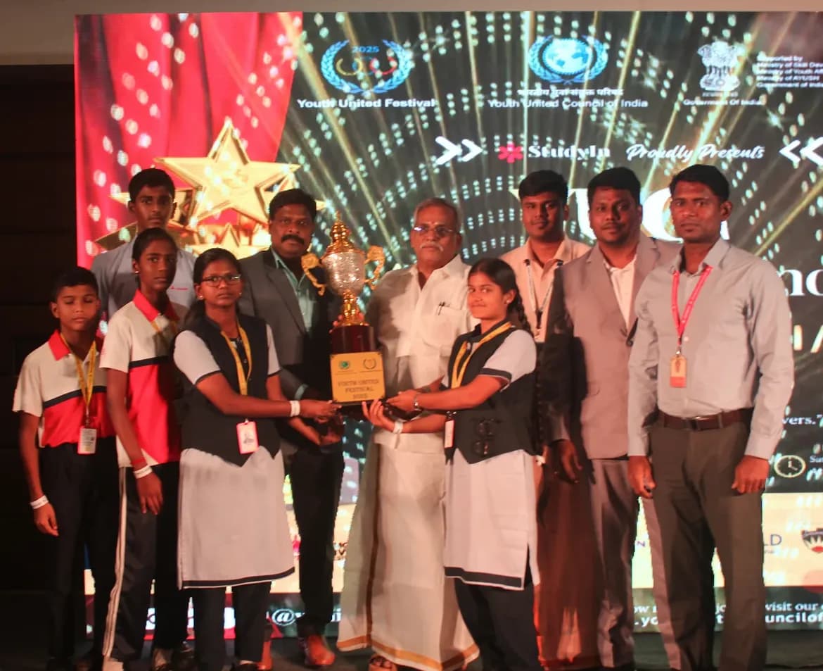 Champions receiving the YUF 2025 championship trophy on stage