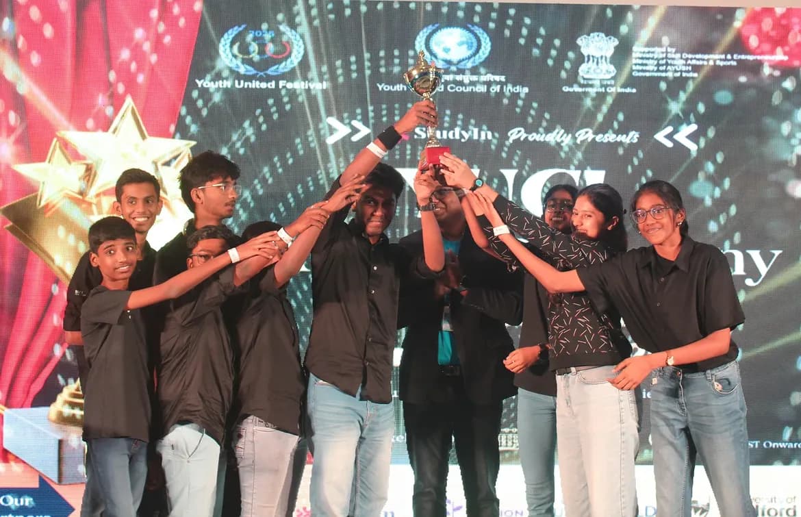 Winning team lifting the YUF 2025 trophy together